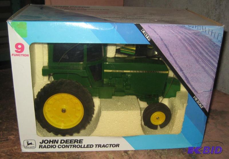 lot 004 image: John Deere 9 Function Radio Controlled Tractor