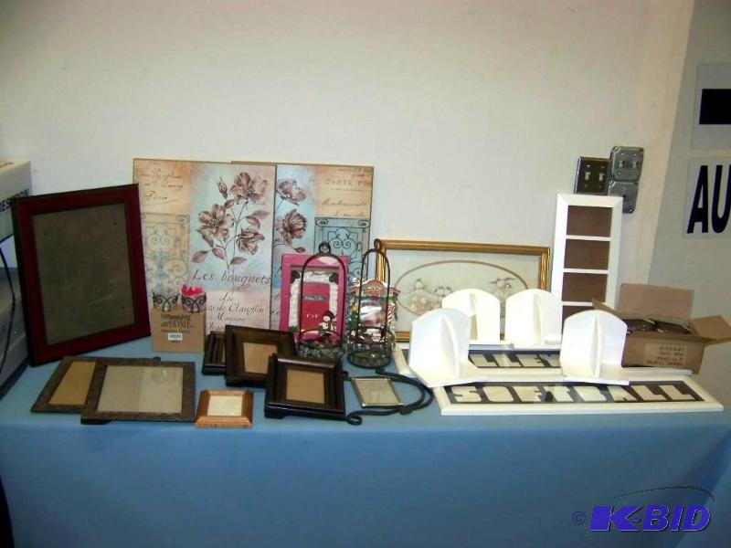 lot 10 image: Large Assortment of Picture Frames, Art, Keychains and more