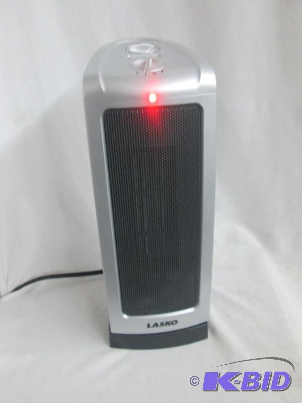 lot 28 image: Lasko 1500 Watt Oscillating Compact Tower Heater