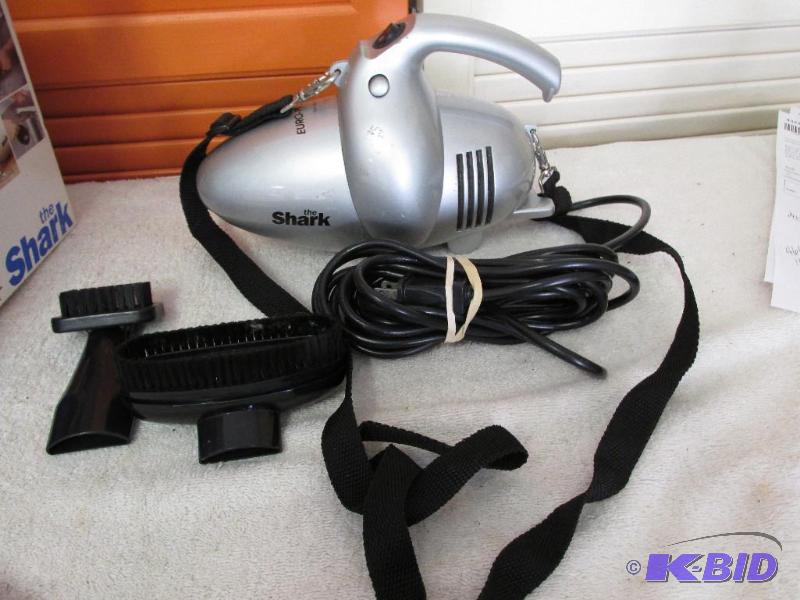 Shark Hand-held (and has a shoulder strap) Vacuum