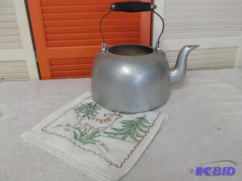 Cast Aluminum Tea Kettle and an Embroidered Dresser Scarf.