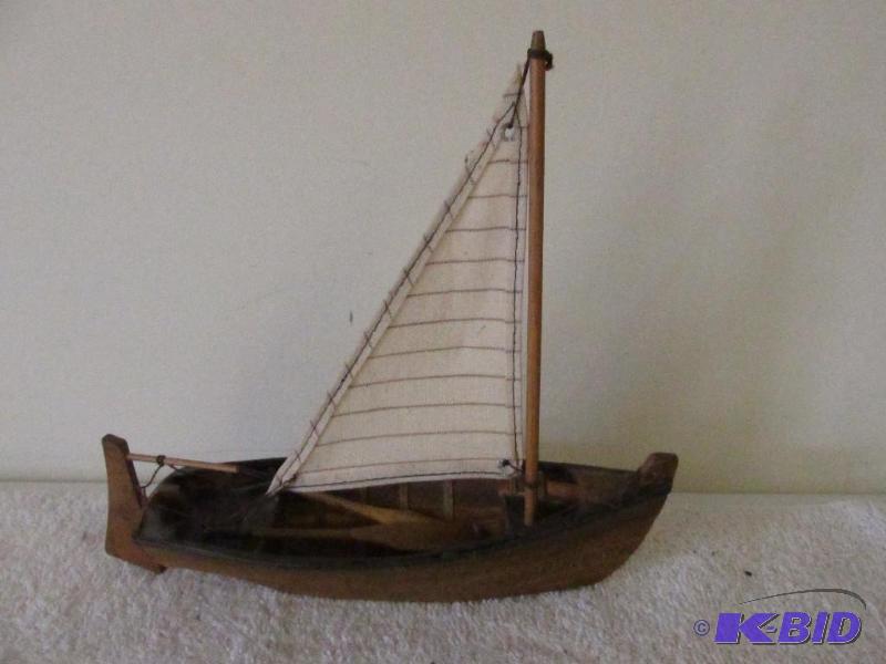 Small Wooden Sail Boat.