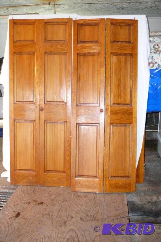 lot 334 image: Solid oak Bi-fold closet door set 13 34 x 73...