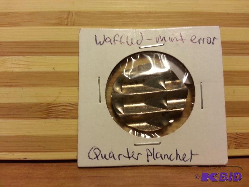 lot 28 image: WAFFLED MINT ERROR QUARTER PLANCHET...