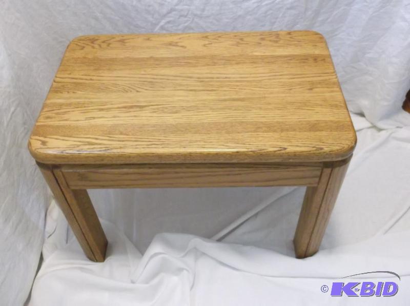 lot 10 image: Solid oak end table measuring 17" W x 27...