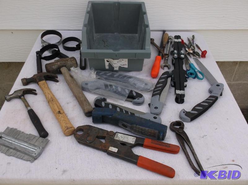 lot 132 image: Gray bin full of tools hammers,hand limb saws...