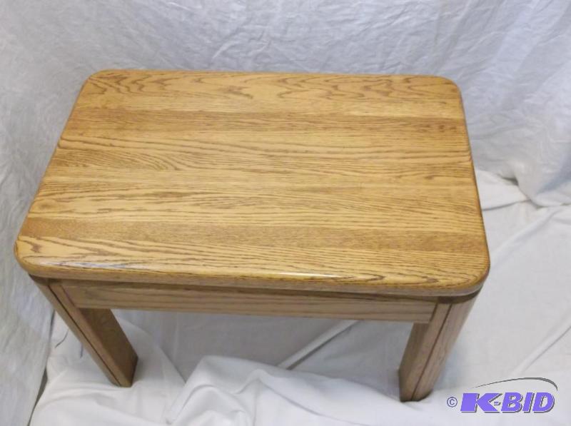 lot 9 image: Solid oak end table measuring 17" W x 27...