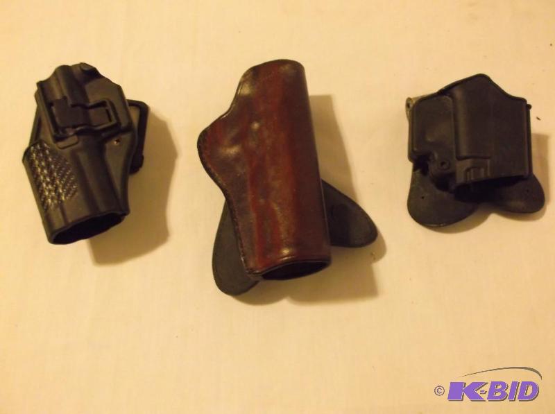 lot 99 image: Lot with 3 holsters all appear in good usable...