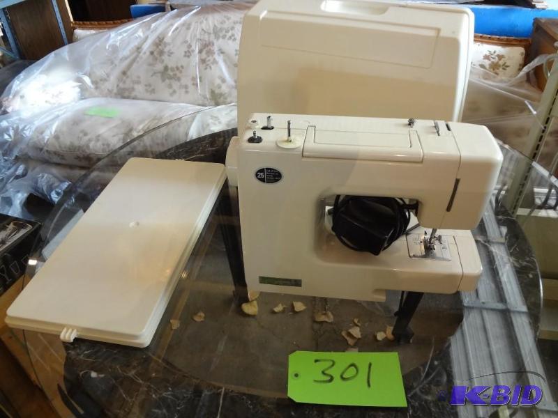 lot 301 image: Kenmore Portable Sewing Machine...