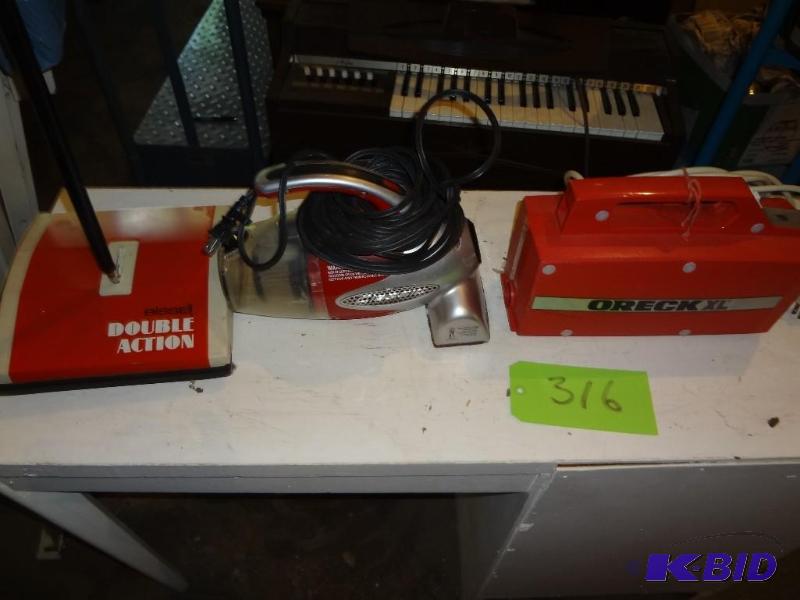 lot 316 image: Three Vacuums...
