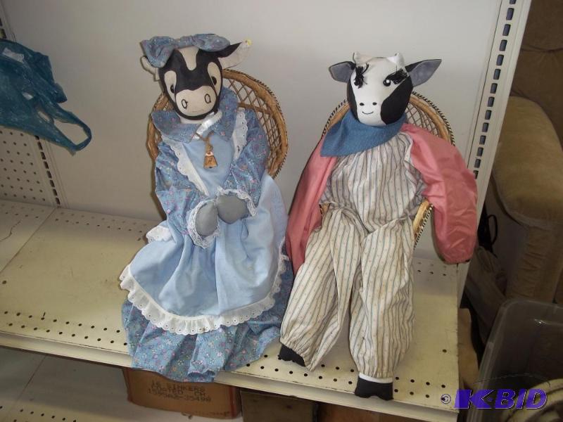 lot 185 image: Mr and Mrs Cow in Wicker chairs...