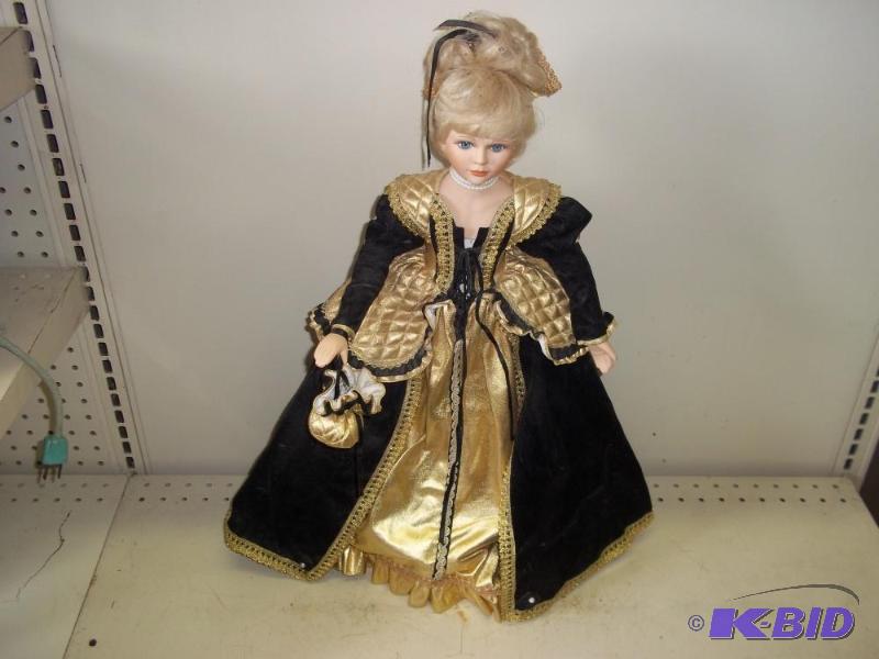 lot 186 image: Porcelain Doll   Black and Gold Dress ...