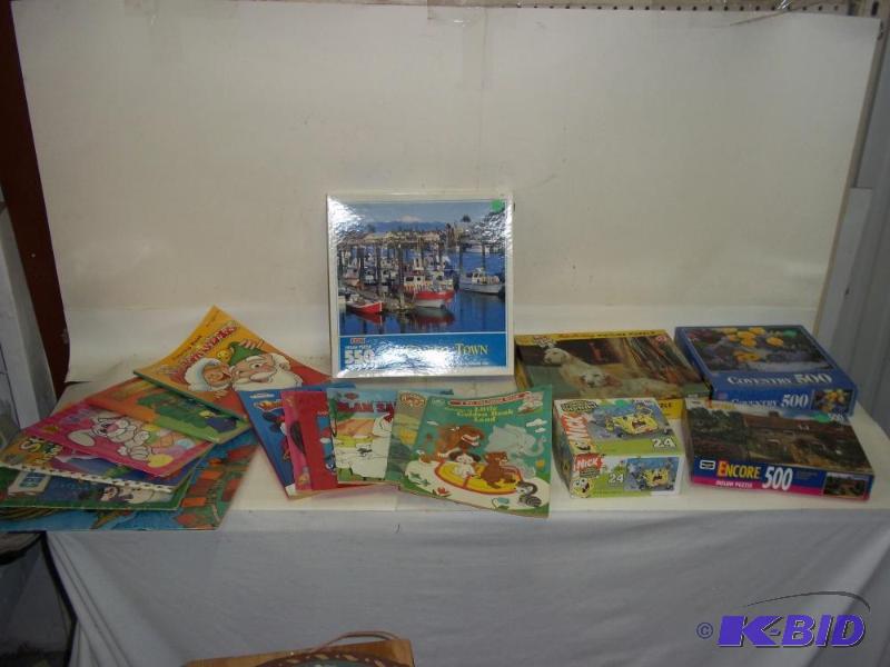 lot 303 image: Assortment of puzzles and coloring books...