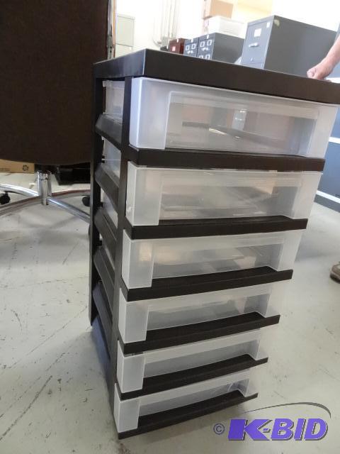 lot 134 image: 6 drawer plastic cabinet on wheels....