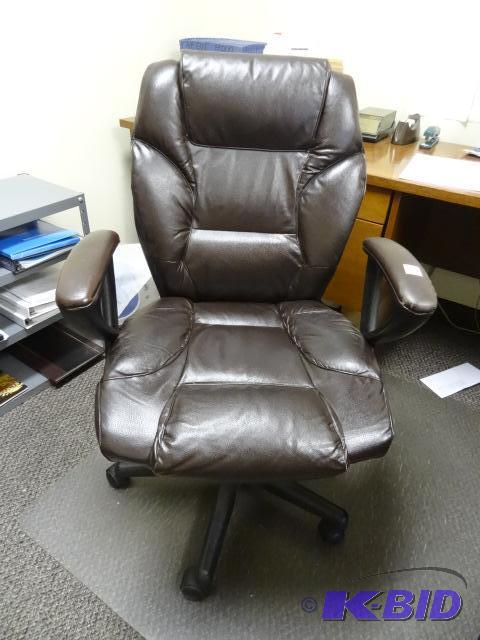 lot 223 image: Leather office chair on wheels....