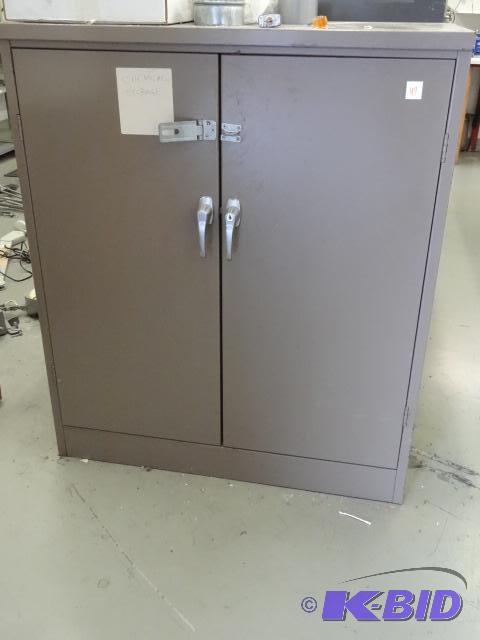 lot 47 image: 2 door metal cabinet. 36 x 19 x 42. 2 shelves...