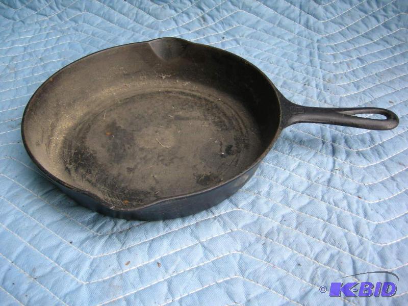 lot 104 image: Griswold No. 8 704 cast iron skillet