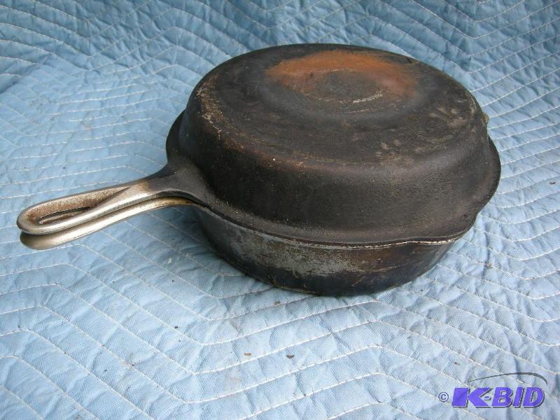 lot 106 image: Griswold Erie PA cast iron double skillet top and bottom 1022 and 1021