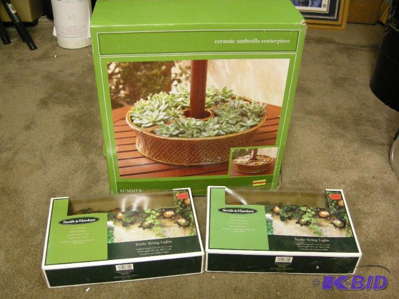 lot 143 image: Ceramic umbrella centerpiece (for patio table) and lights