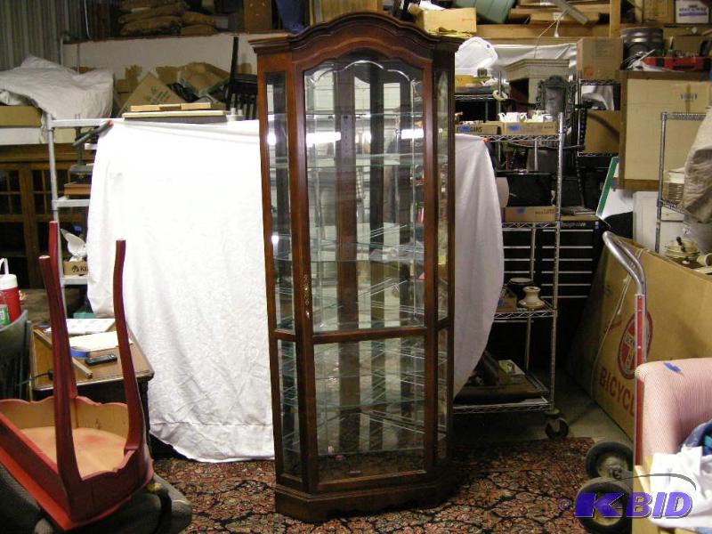 lot 9 image: Howard Miller corner cabinet