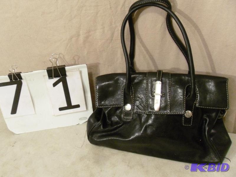 lot 71 image: Black Purse Marked Michael Kors. Wear and tea...