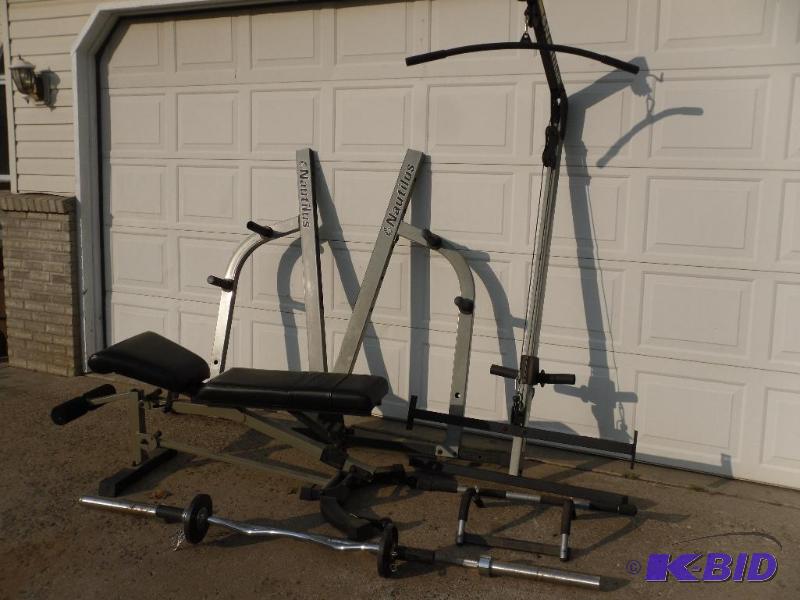lot 8 image: Nautilus Gym System. Comes with small curling...
