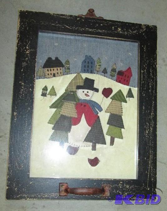 old window frame with stitch scene of a snowm...