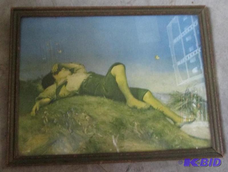 framed art boy laying on a hill- frame is nee...