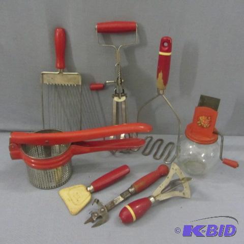 lot 33 image: Red Handled Utensils