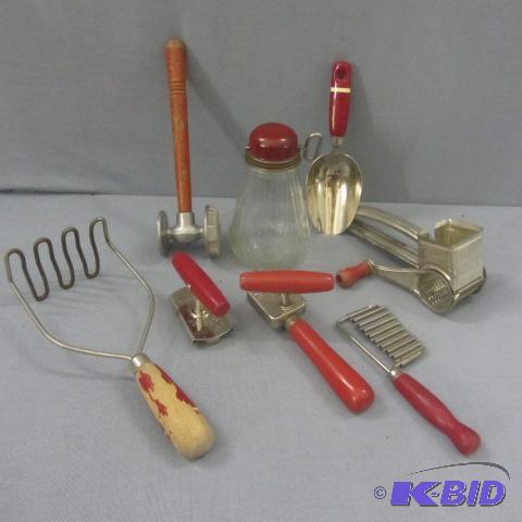 lot 34 image: Red Handled Utensils