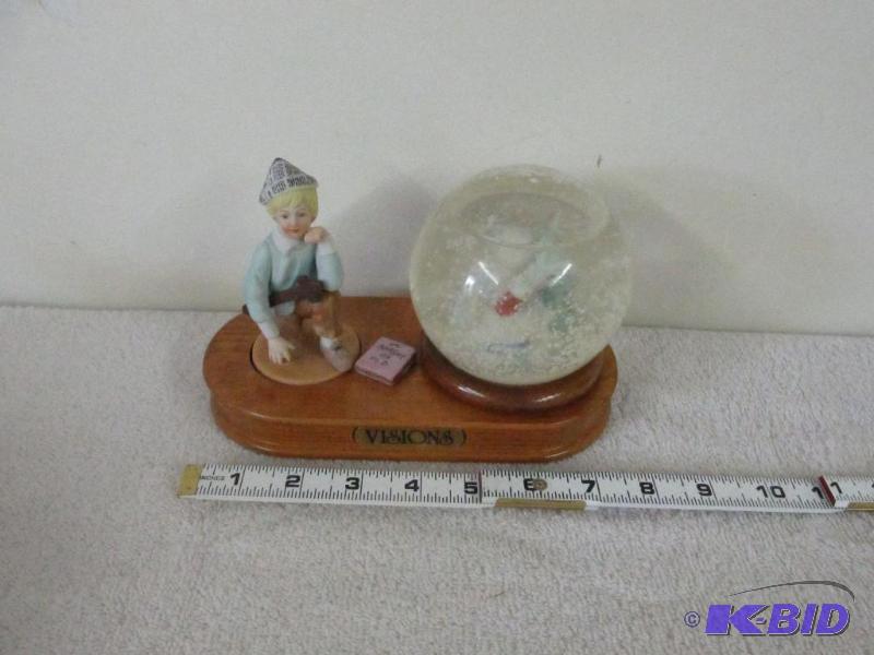 Snow Globe, a Young Man Dreaming of Dragons