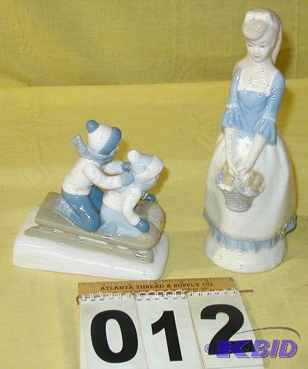 lot 12 image: Pair of Porcelain Figurines The girl with flo...
