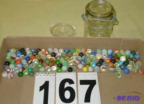 lot 167 image: Pint of Marbles in a Lock-Top Jar The Star Ma...