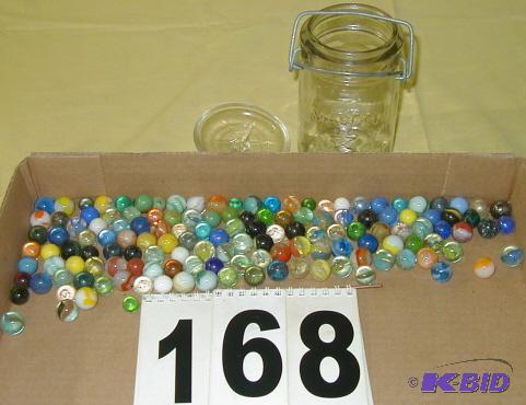 lot 168 image: Pint of Marbles in a Lock-Top Jar The Star Ma...