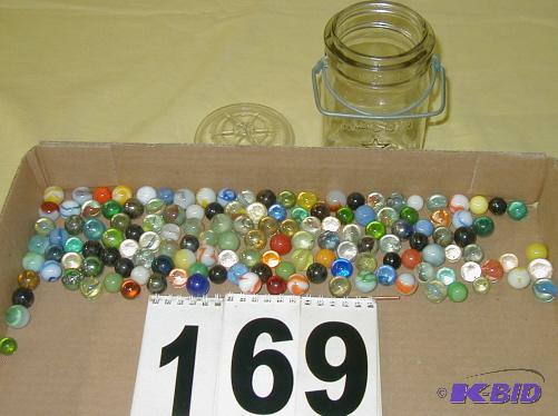 lot 169 image: Pint of Marbles in a Lock-Top Jar The Star Ma...