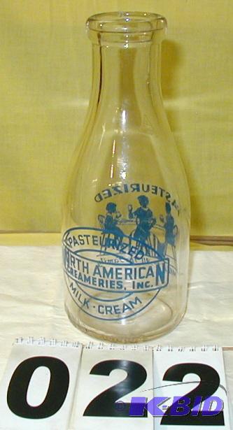 lot 22 image: Vintage Quart Milk Bottle with Nice Graphics ...