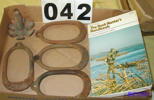 lot 42 image: Five Vintage Herters Duck Decoy Weights and D...