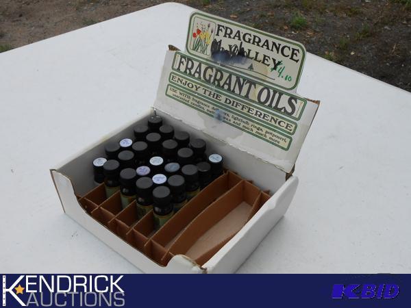 lot 199 image: 25 Aromatherapy Scented Oils in display case.