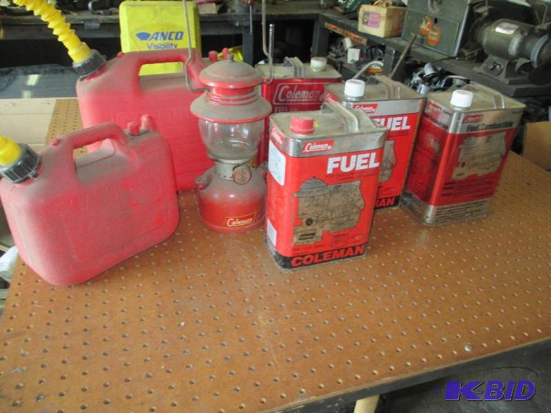 lot 157 image: Coleman Kerosene lantern 2 gas cans and lantern gas