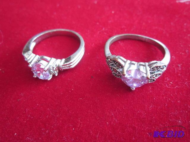 Pair of costume jewelry rings with stones....