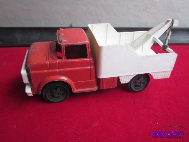 Metal tow truck with plastic wheels and rear,...