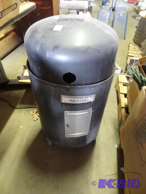 lot 4 image: Cookin cajun II charcoal smoker and grill. Co...