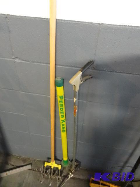 lot 45 image: Grass trimmer. Feeder Kane fertilzer stick. G...