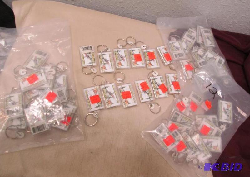 Qty 48 Key chains that says North Dakota stat...