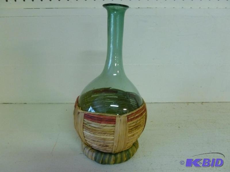 lot 120 image: Beautiful hand blown glass vase in a weaved b...
