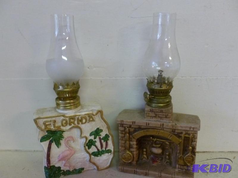 lot 157 image: Lot of two oil lamps that includes a fireplac...
