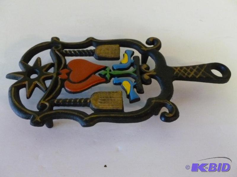lot 82 image: Large Wilton cast iron wall trivet that measu...