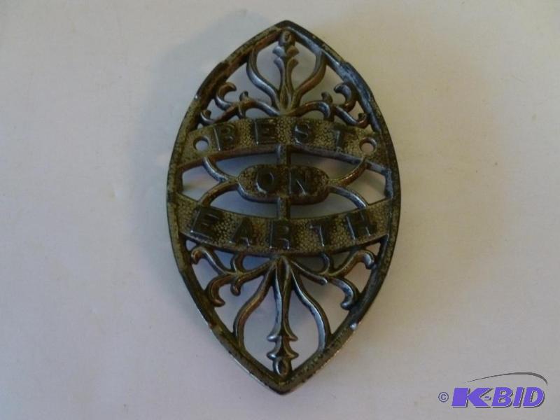 lot 85 image: Antique Best On Earth cast iron wall trivet t...