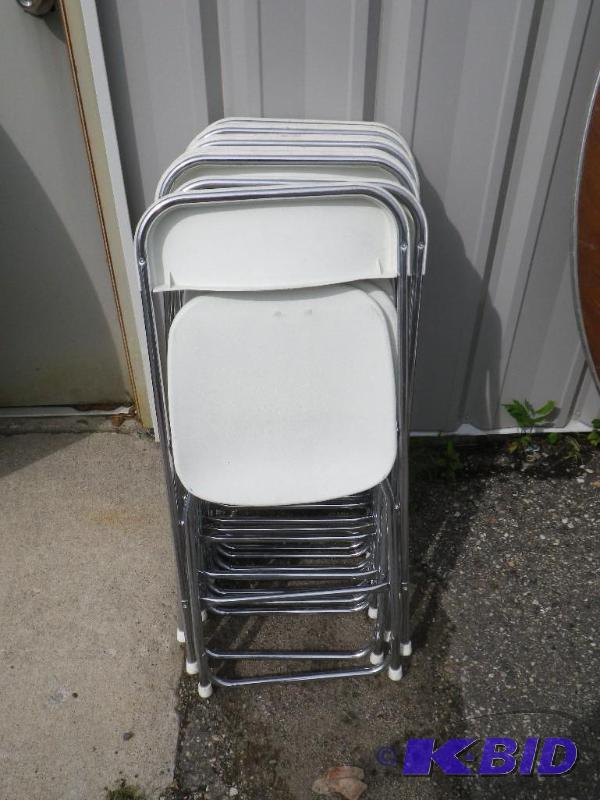 10 white plastic folding chairs with chrome f...