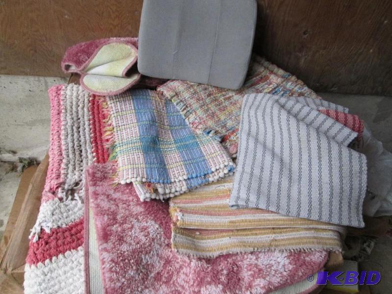 mixed lot of assorted rugs and a back support...